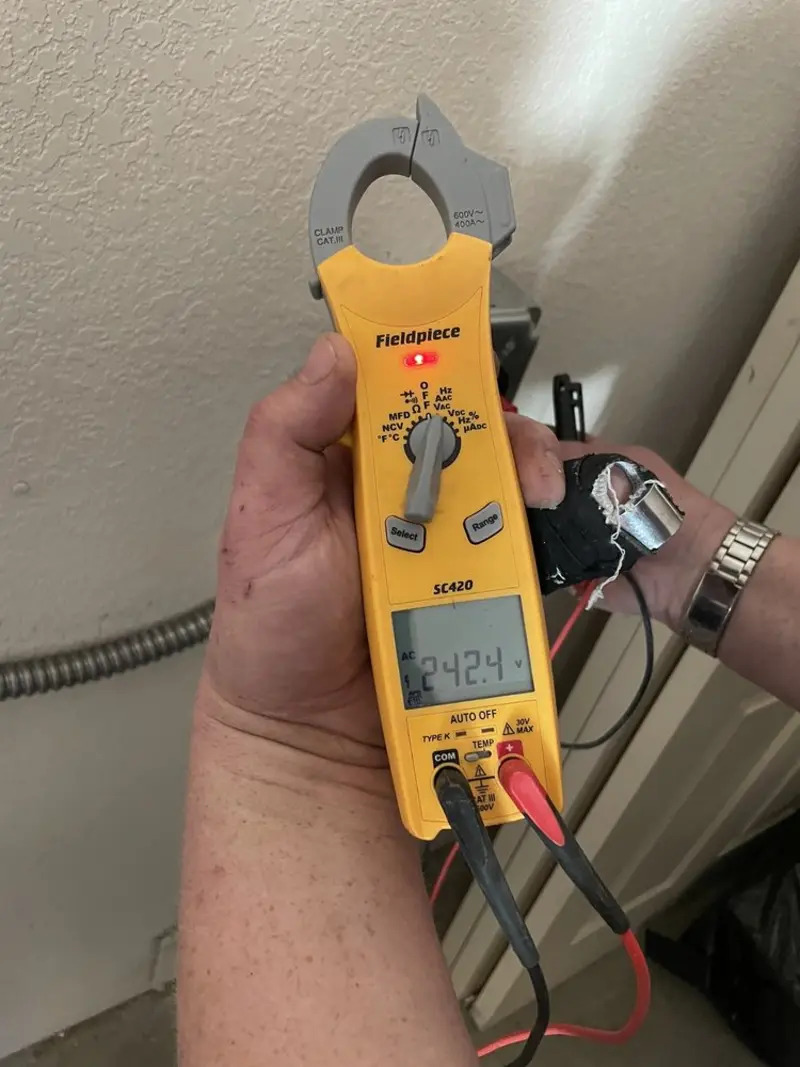 Voltage testing with clamp meter during Generator Installation in Desert Aire